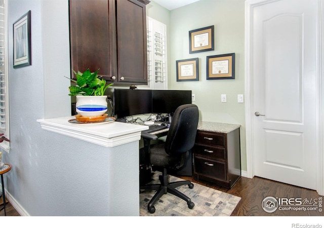 home office featuring dark wood-style floors and baseboards