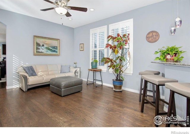 living area featuring ceiling fan, recessed lighting, wood finished floors, and baseboards