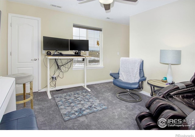 interior space with baseboards, carpet, visible vents, and a ceiling fan