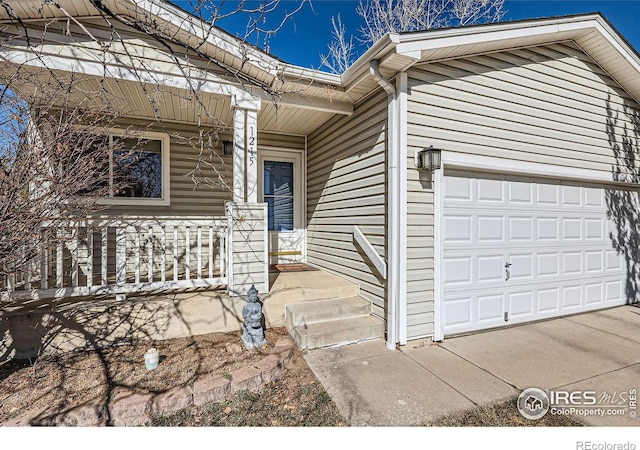 view of front of home with a garage and a porch