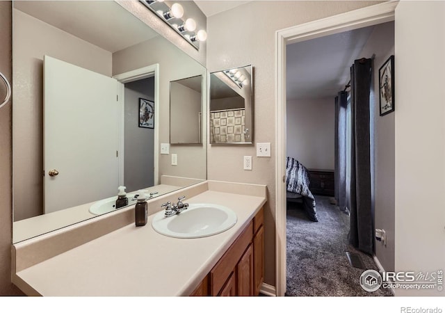 full bath with visible vents and vanity