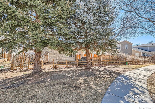 obstructed view of property featuring fence