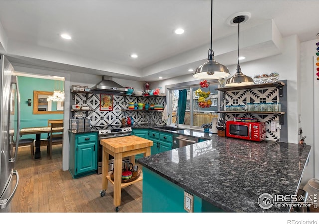 kitchen featuring open shelves, recessed lighting, appliances with stainless steel finishes, wall chimney range hood, and wood finished floors