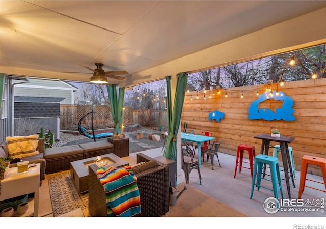 view of patio / terrace with outdoor dining area, outdoor lounge area, ceiling fan, and a fenced backyard