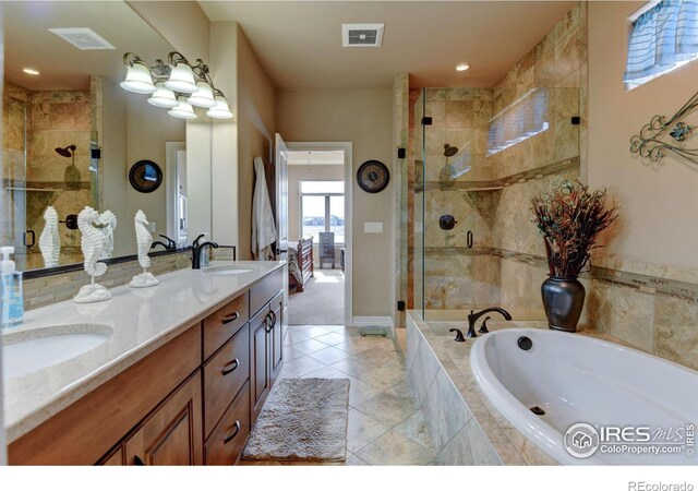 full bathroom featuring a garden tub, a sink, visible vents, double vanity, and a stall shower