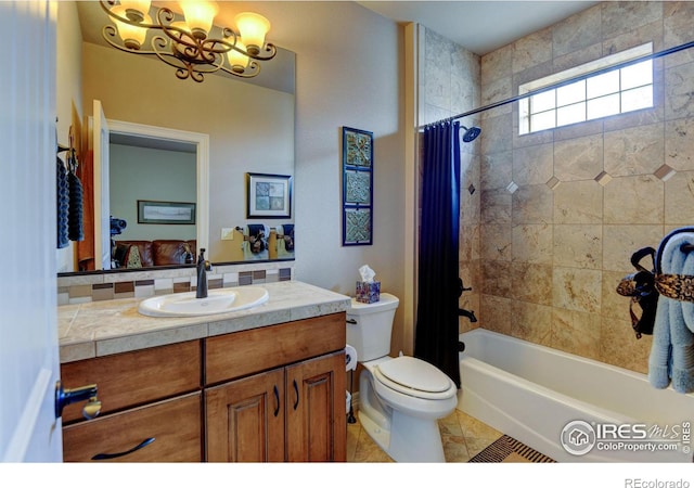 bathroom with toilet, a notable chandelier, shower / tub combo, vanity, and tile patterned floors