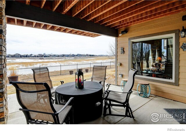 view of patio / terrace featuring fence and outdoor dining space