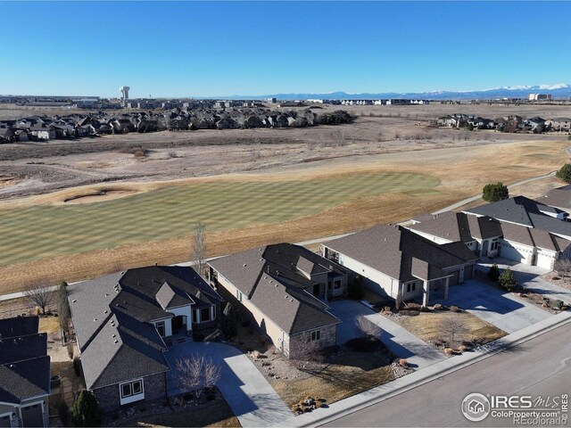 aerial view featuring view of golf course and a residential view