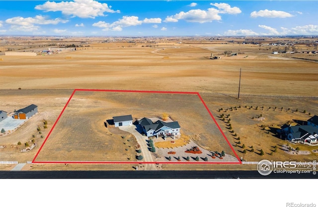 bird's eye view featuring a desert view and a rural view