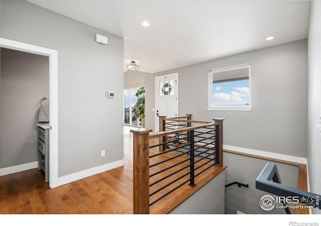 dining space featuring baseboards, wood finished floors, a wealth of natural light, and recessed lighting