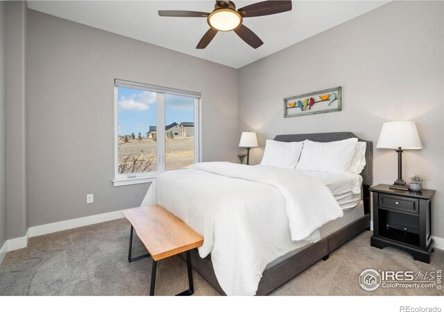 bedroom with carpet flooring, ceiling fan, and baseboards