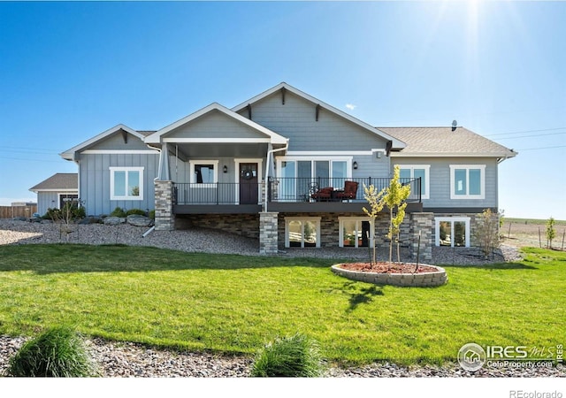 craftsman-style home with board and batten siding and a front yard