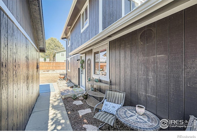 view of patio featuring fence