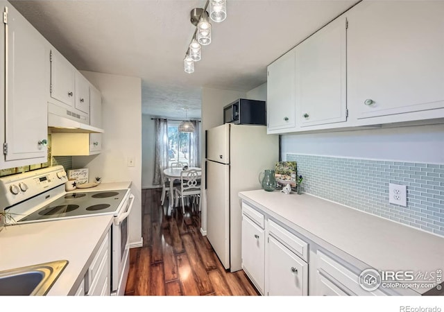 kitchen featuring under cabinet range hood, white cabinetry, white appliances, and light countertops