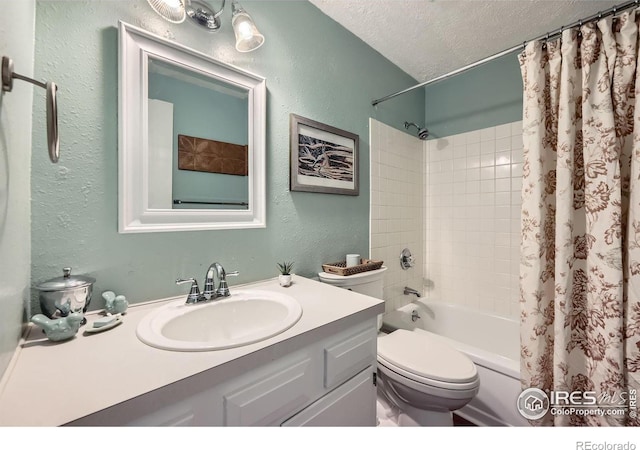 bathroom with a textured ceiling, a textured wall, shower / bath combination with curtain, and vanity