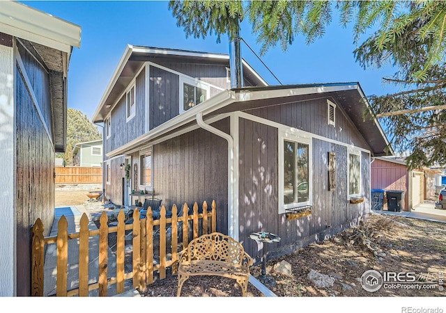 view of front of house with fence