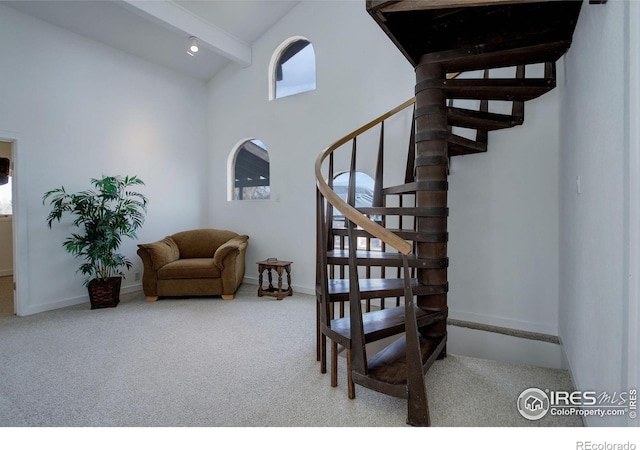 stairs featuring high vaulted ceiling, beamed ceiling, carpet floors, and baseboards