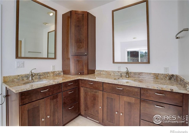 bathroom featuring double vanity and a sink