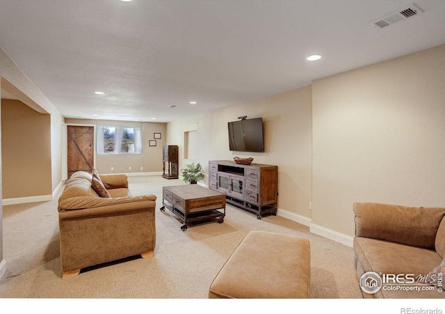 living room with light carpet, recessed lighting, visible vents, and baseboards