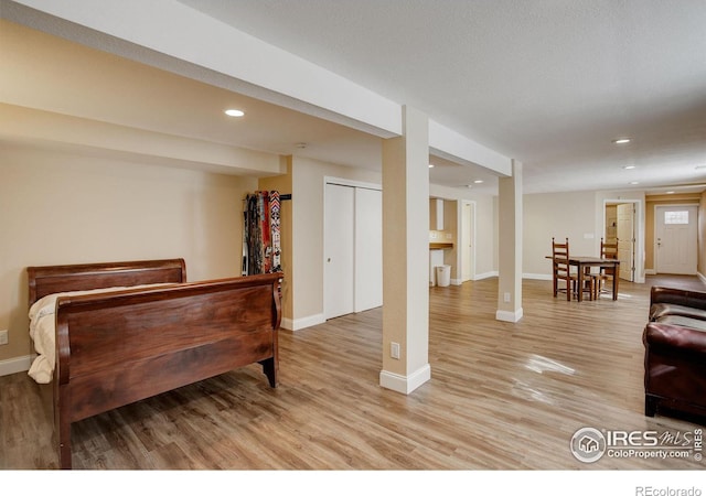 interior space featuring light wood finished floors, baseboards, and recessed lighting