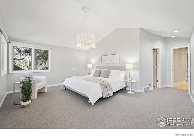 carpeted bedroom featuring baseboards, visible vents, vaulted ceiling, and a notable chandelier