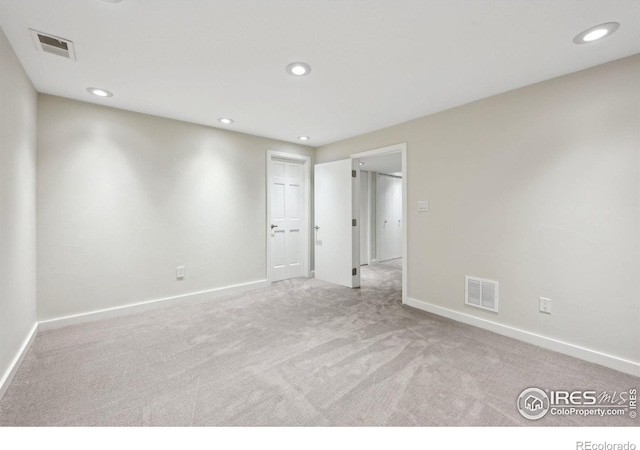 unfurnished bedroom featuring recessed lighting, baseboards, visible vents, and carpet flooring