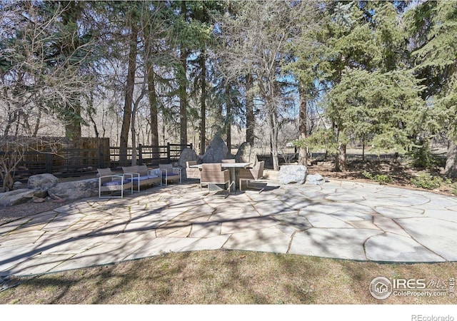 view of patio / terrace with an outdoor hangout area and fence