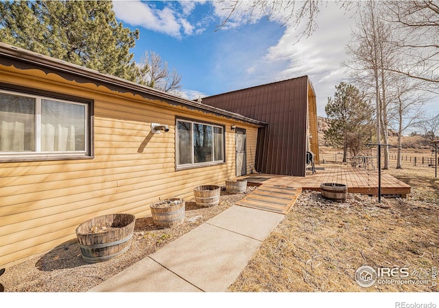 doorway to property with a wooden deck