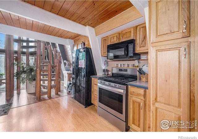 kitchen with dark countertops, wood ceiling, beamed ceiling, light wood-type flooring, and black appliances