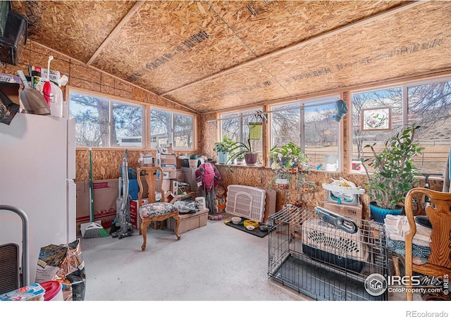 sunroom featuring lofted ceiling