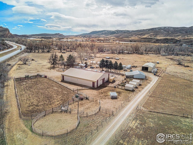 aerial view featuring a rural view and a mountain view