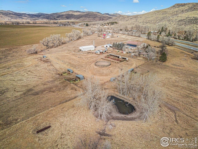 bird's eye view featuring a mountain view and a rural view