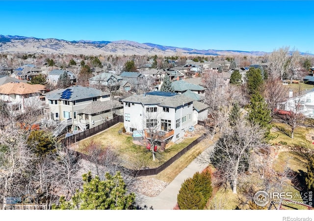 birds eye view of property with a residential view and a mountain view