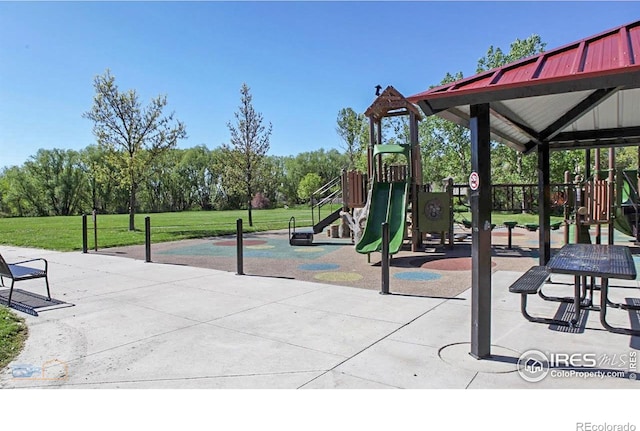 communal playground featuring a yard