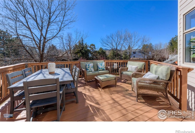 deck with outdoor dining area and outdoor lounge area