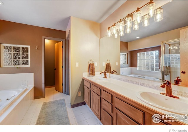 full bath with a whirlpool tub, tile patterned flooring, double vanity, and a sink