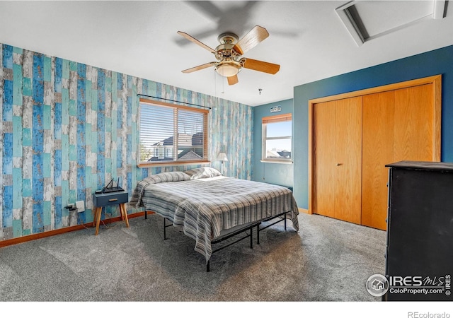 bedroom with baseboards, carpet, attic access, and wallpapered walls