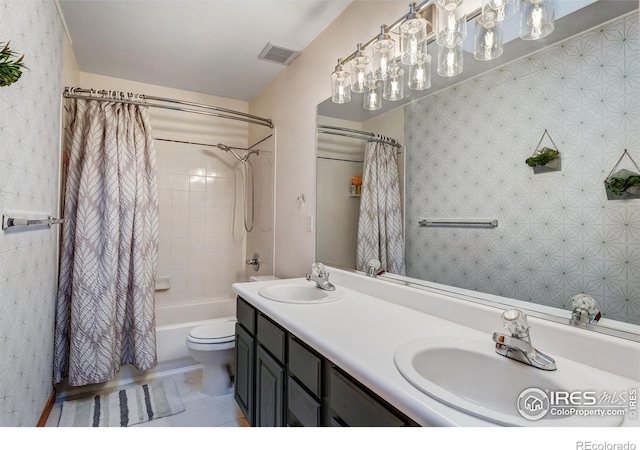 bathroom with double vanity, visible vents, shower / bath combo with shower curtain, and a sink