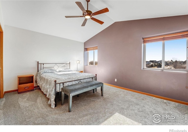 carpeted bedroom featuring visible vents, vaulted ceiling, baseboards, and ceiling fan