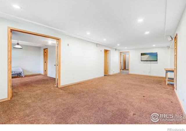 interior space with carpet, baseboards, and recessed lighting