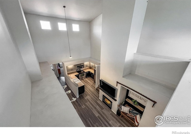 1004 Lucca Dr, Evans, CO 80620 - living room with a towering ceiling and dark wood finished floors