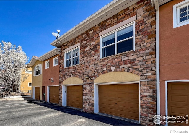 1004 Lucca Dr, Evans, CO 80620 - view of front of house with stucco siding and stone siding