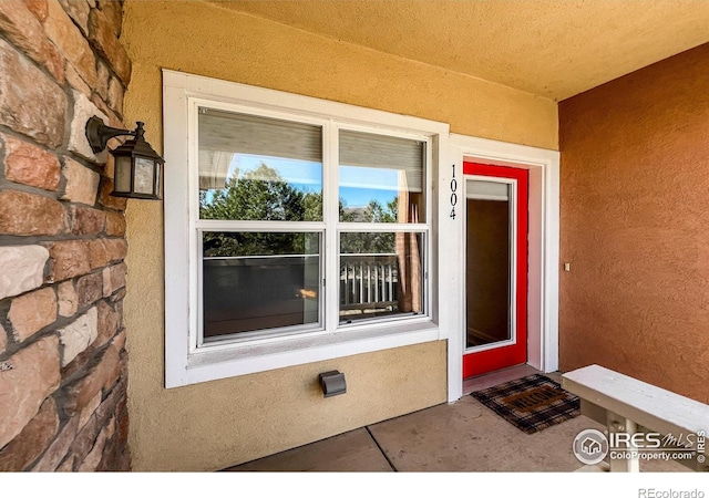 1004 Lucca Dr, Evans, CO 80620 - property entrance featuring stucco siding