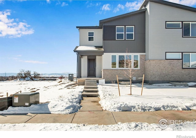 view of front of house featuring brick siding