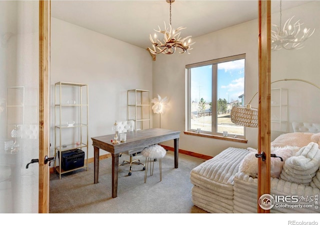carpeted office featuring baseboards and a chandelier