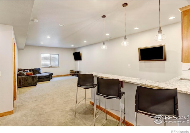 bar with carpet floors, recessed lighting, baseboards, and pendant lighting