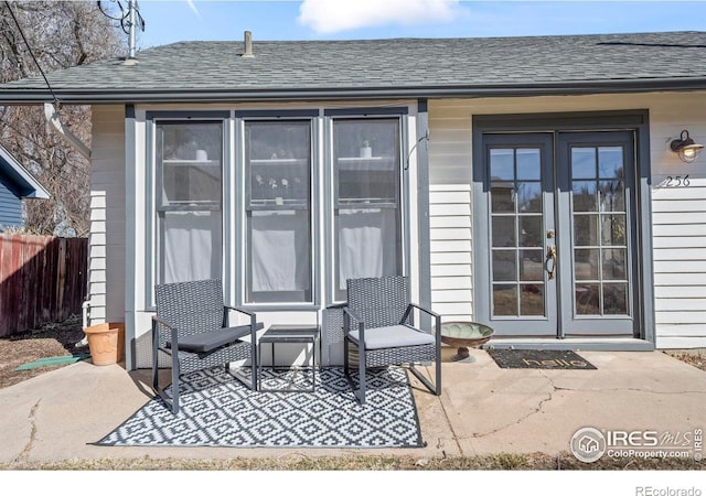 view of patio / terrace with french doors and fence