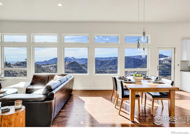 interior space featuring dark wood-style floors, a mountain view, and recessed lighting