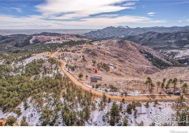 birds eye view of property with a mountain view