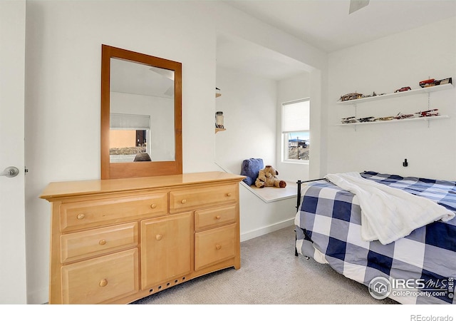 bedroom with light colored carpet